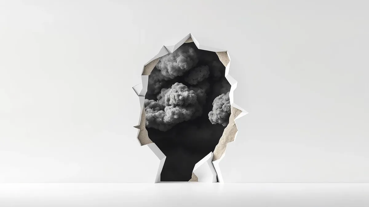 Illustration: A stark white wall stands with a wide, jagged breach torn through its center.
